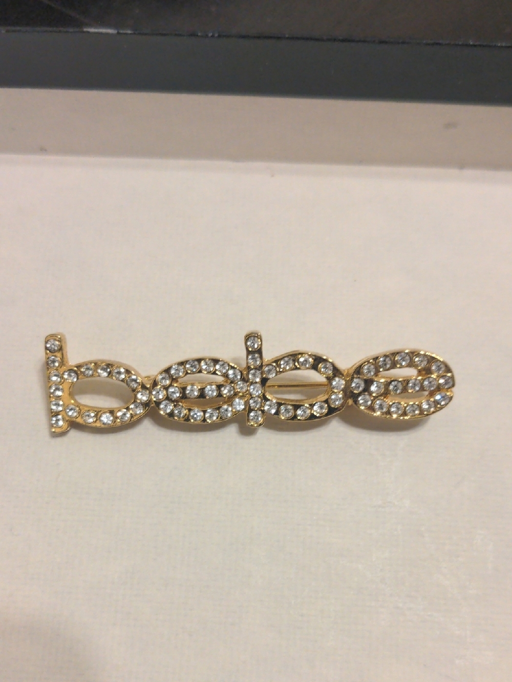 Gold-Tone Rhinestone 'bebe' Logo Pin